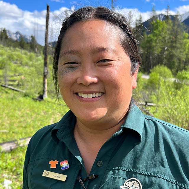 A headshot photo of Jane Park wearing a Parks Canada uniform.