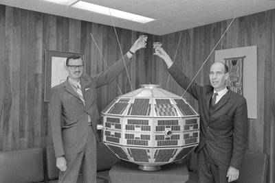 Dr. Leroy Nelms & Dr. John Chapman toasting Alouette Satellite (© Ted Grant / Library and Archives Canada | Bibliothèque et Archives Canada / e010689790)