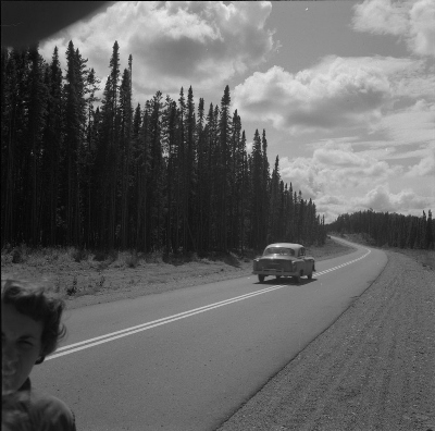 Audrey James beside the Trans-Canada Highway during a trip in August 1954. © Library and Archives Canada |  Bibliothèque et Archives Canada, Rosemary Gilliat Eaton, Mikan 4307680.