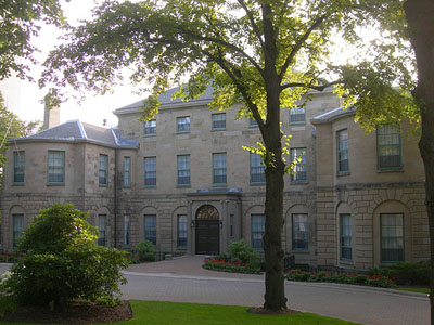 General view of Government House, showing the Palladian-inspired design of the house, with its central three-storey pavilion under a low hipped roof, 2010. © Government House, Jimmy Emerson, 2010.