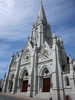 General view of St. Mary's Basilica, showing the High Victorian Gothic Revival style facade with its elaborate triple portal and central tower with dressed granite spire, 2009. © St. Mary's Basilica, Glenn Euloth, 2009.