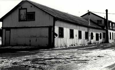 View of the Woodworking Shop, showing the wood frame construction, 1989. © Agence Parcs Canada / Parks Canada Agency, 1989.