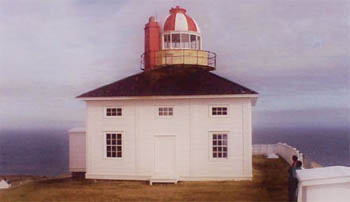 General view of Cape Spear Lighthouse demonstrating the expression of neoclassical design principles in the large balanced rectangular windows on the ground floor topped by smaller ones (some false) on the upper storey, 2000. © Parks Canada | Parcs Canada, 2000