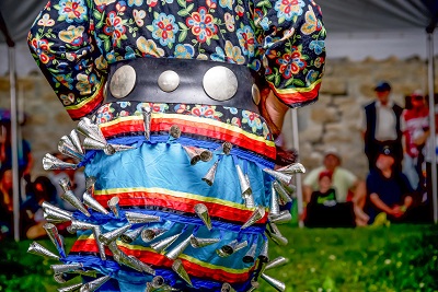 Indigenous dancer preforming under a tent at Lower Fort Garry National Historic Site, August 1, 2016. © Parcs Canada | Parks Canada, Gabrielle Touchette, 2016